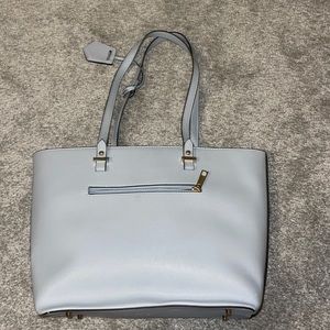 Blue purse with brown lining